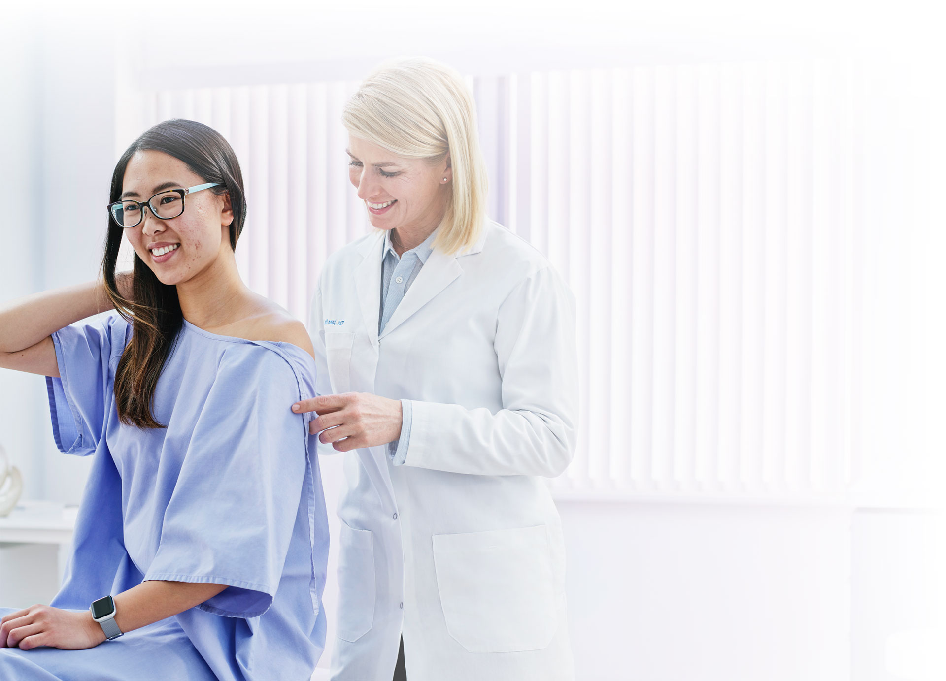 A young woman being examined by a doctor