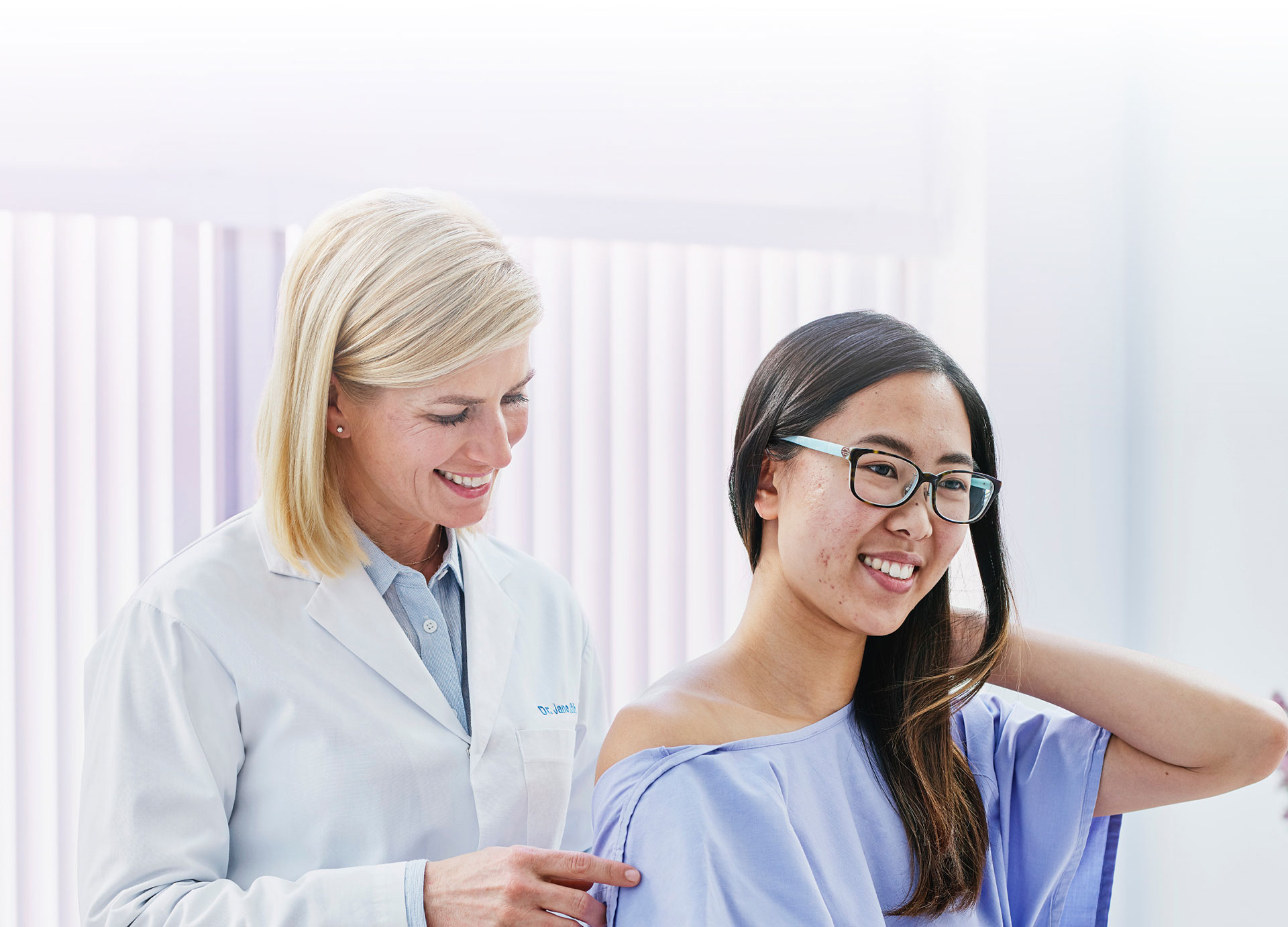 A young woman being examined by a doctor